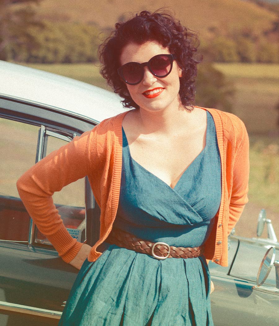 Woman Smiling and Standing Next to Vintage Car